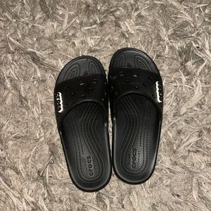Black croc slides. Worn twice. Includes charms.  Women’s size 8